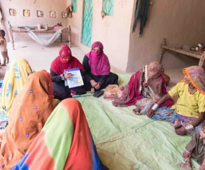 Shagufta Razzaque holds a community support group meeting in Yousfani Farm